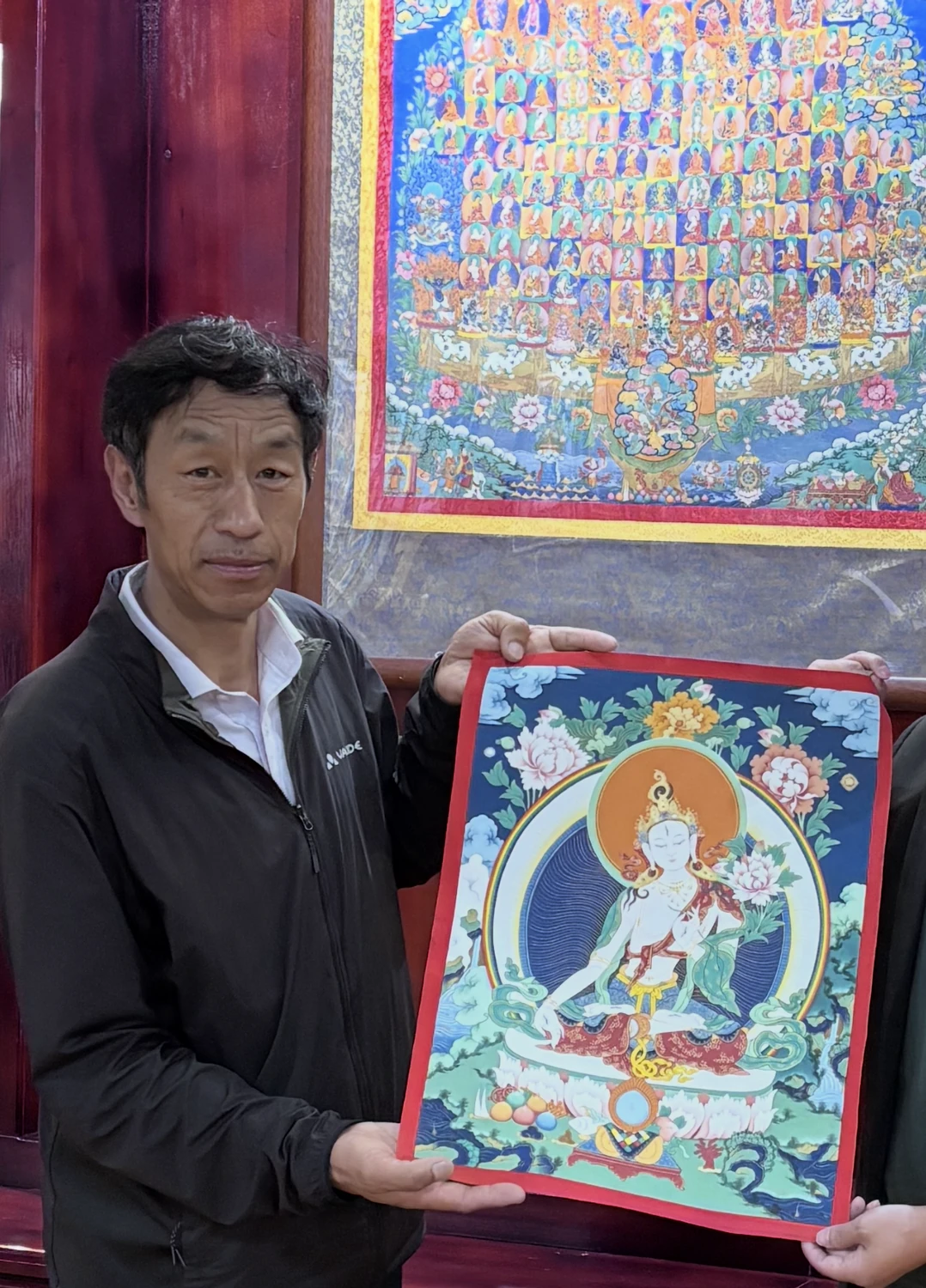 Robu holding a thangka